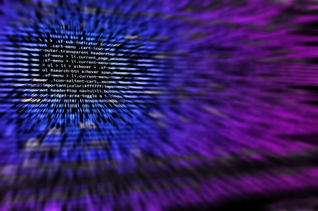 Blurred CSS source code on a screen, streaked in blue and purple